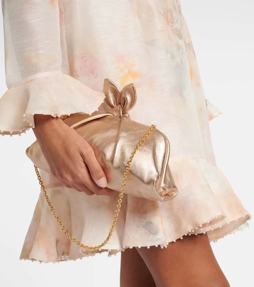 Aquazzura Bow Tie metallic leather clutch